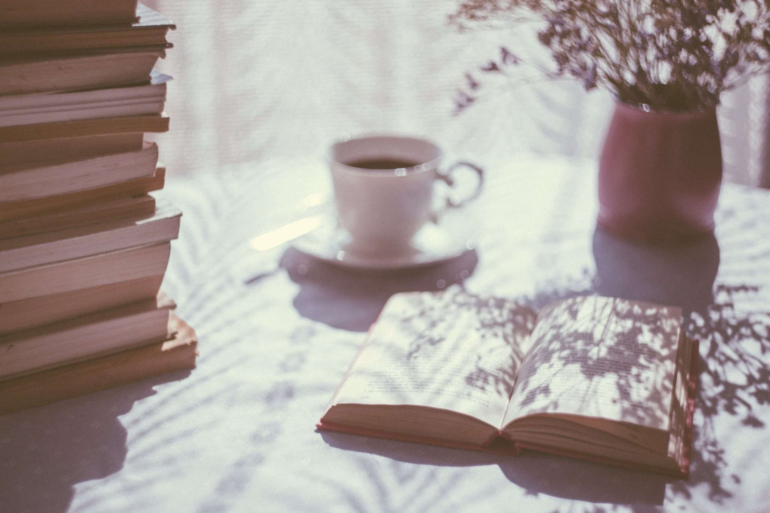 Open book with coffee cup